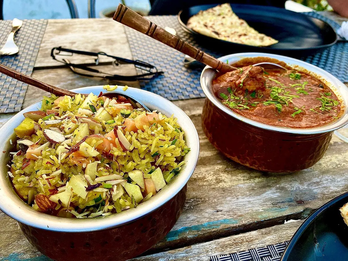 One table, many small bowls — Jaajam Restaurant, Udaipur