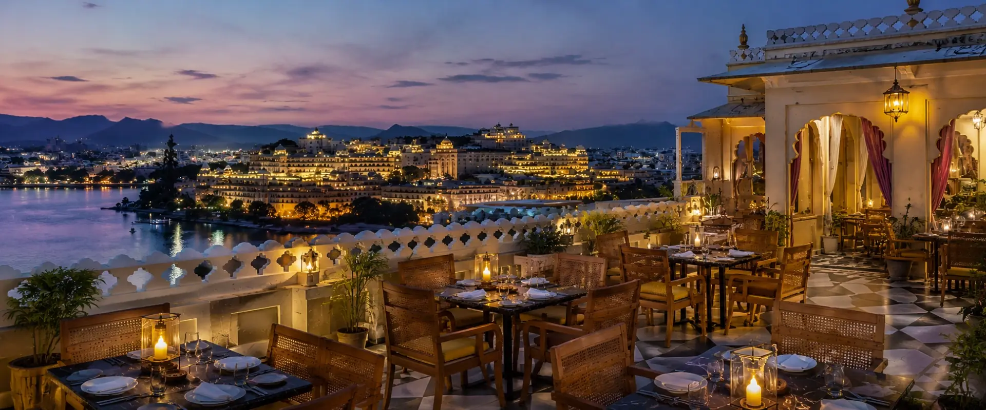 The rooftop at dusk, over the lake — Jaajam Restaurant, Udaipur