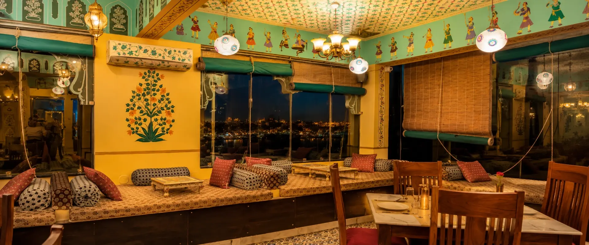 Heritage lounge seating with Rajasthani textiles at Jaajam Restaurant, Udaipur