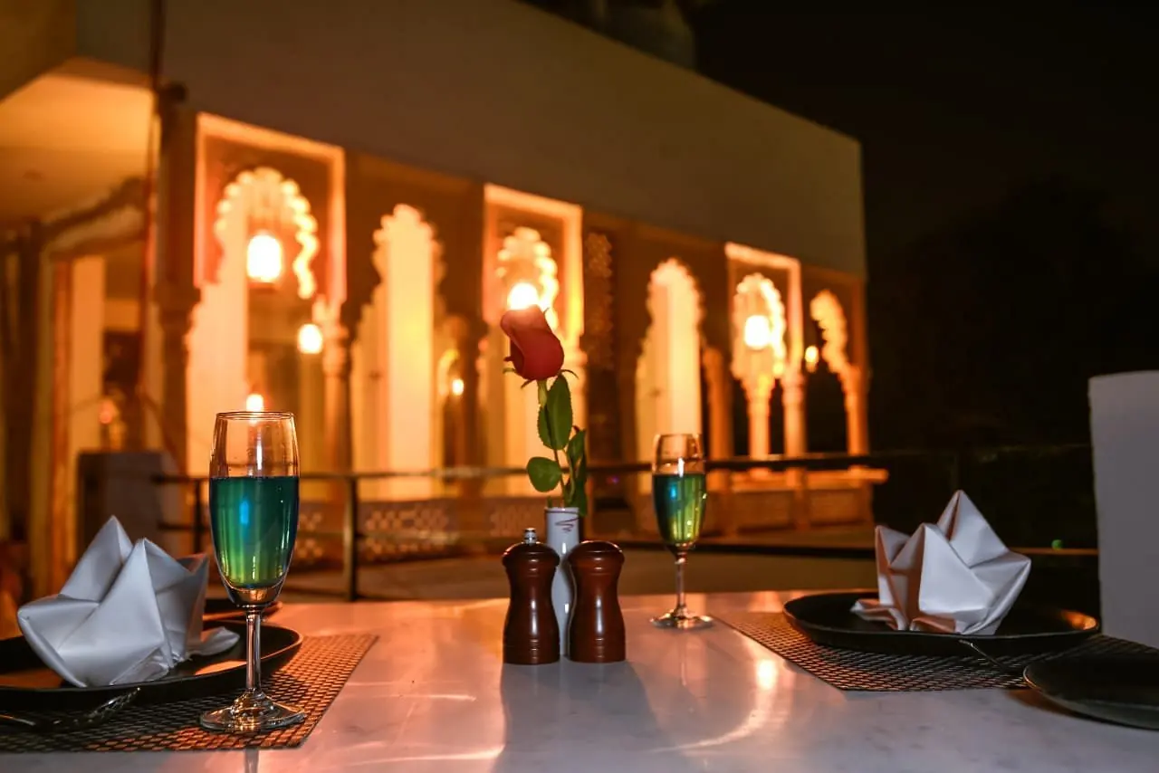 Lantern-lit arches after dark — Jaajam Restaurant, Udaipur