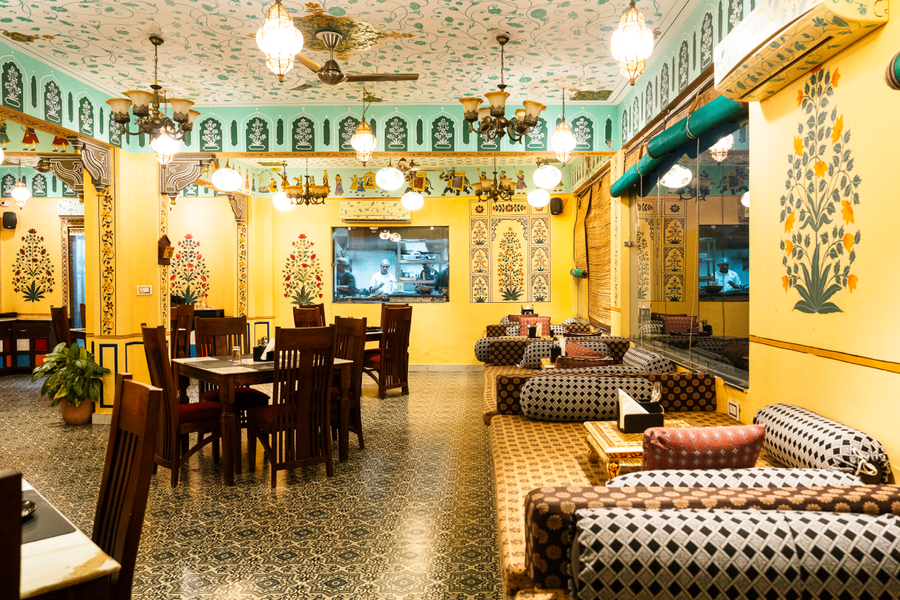 Heritage lounge seating with Rajasthani textiles at Jaajam Restaurant, Udaipur