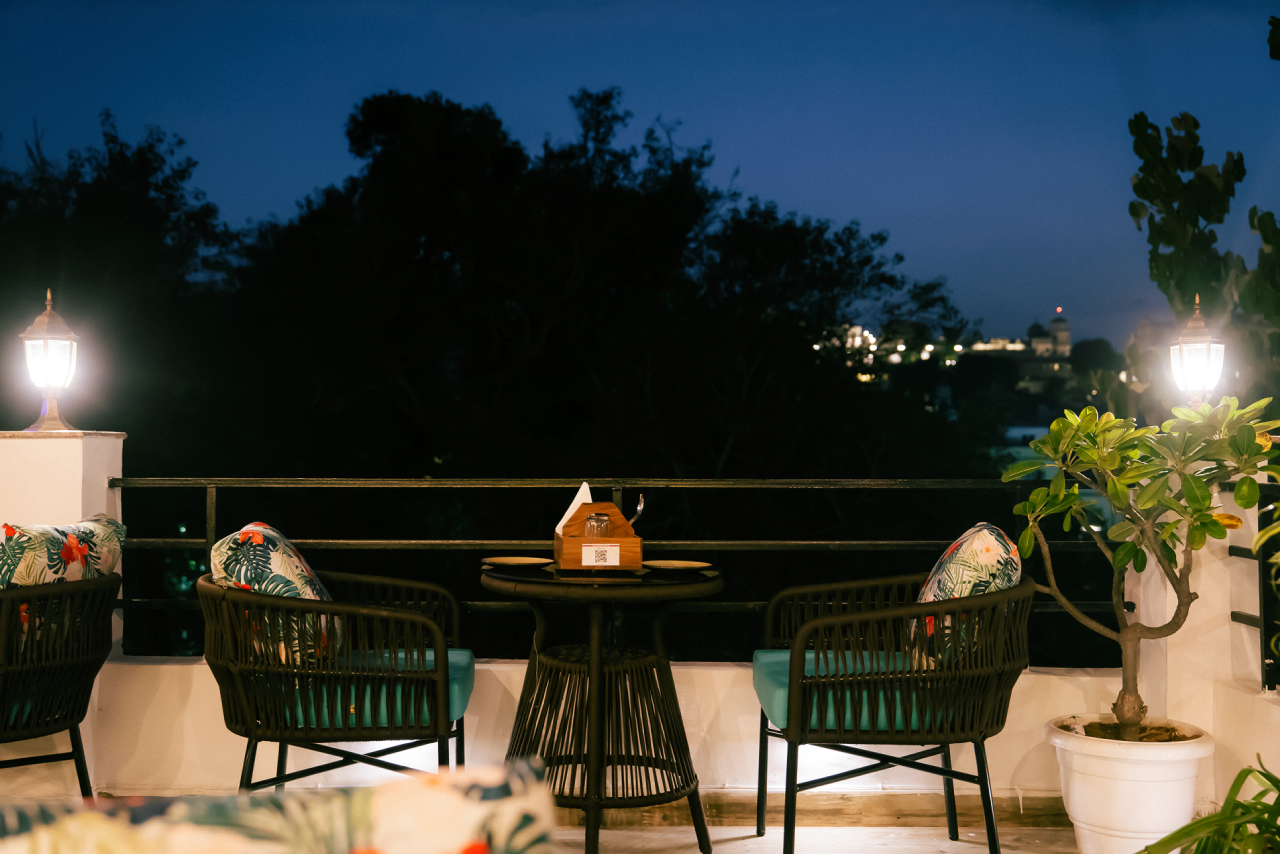 The lantern-lit rooftop colonnade at Jaajam Restaurant, Udaipur